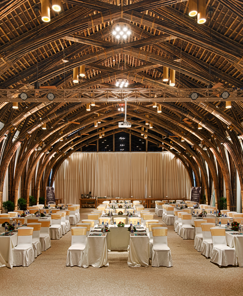 Interior of the conference hall at Naman Retreat showcasing an intricate dome-like bamboo design, blending sustainable architecture with modern elegance. - Disaster-Resilient Architecture